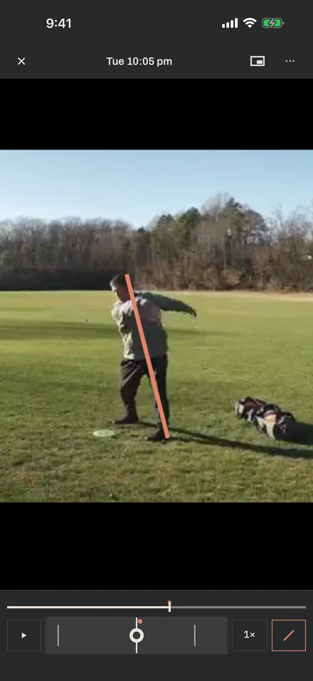 The Film screen: a backhand throw on a field, paused near the release, with one line drawn from the head to the plant foot and the frame scrubber below.